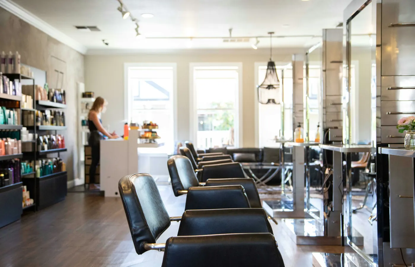 The sunlit salon with styling chairs and mirrors
